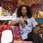 Uman sits on a couch in her studio in Albany, New York.