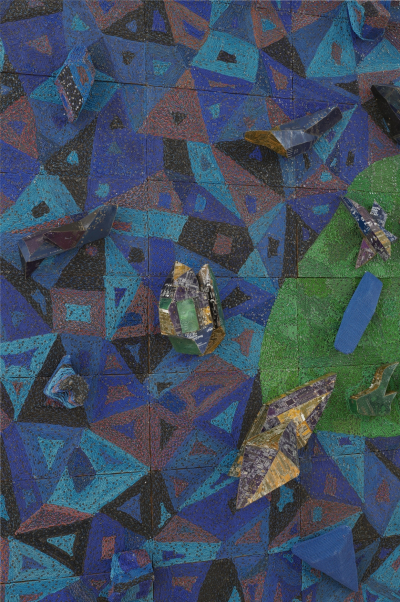 An abstract painting with pieces of gadgetry mounted to it.