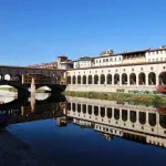FLORENCE, ITALY - NOVEMBER 01: The Ponte Vecchio (Old Bridge) is a medieval bridge spanning the river Arno in Florence. It is one of the few remaining bridges with houses built upon. The Vasari corridor that runs over the houses connects the Uffizi with the Pitti Palace on the other side of the river. Florence, Italy, 1st November 2017. Photo by Tim Clayton/Corbis via Getty Images)