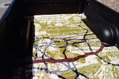 A tufted rug showing the history of the 91 Freeway in Southern California.