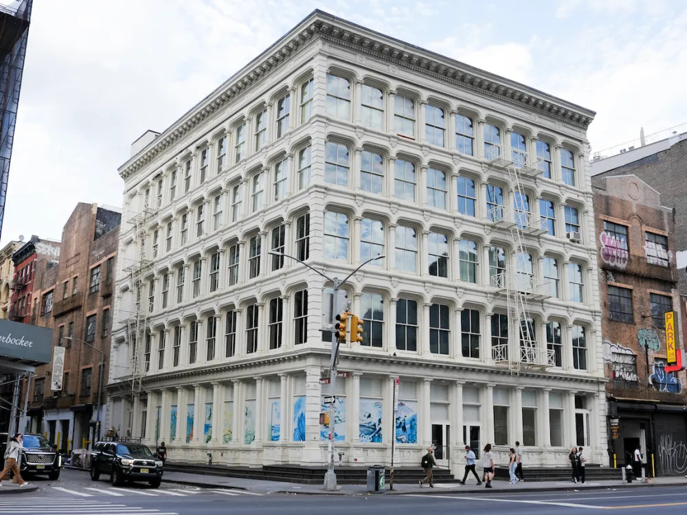 A multistory building on a city street.