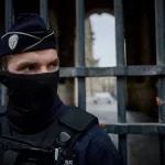 French Police officers seal off the entrance to the Louvre Museum in Paris after a jewel heist on October 19, 2025.